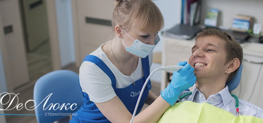 Отбеливание зубов и проф. чистка в стоматологии Делюкс